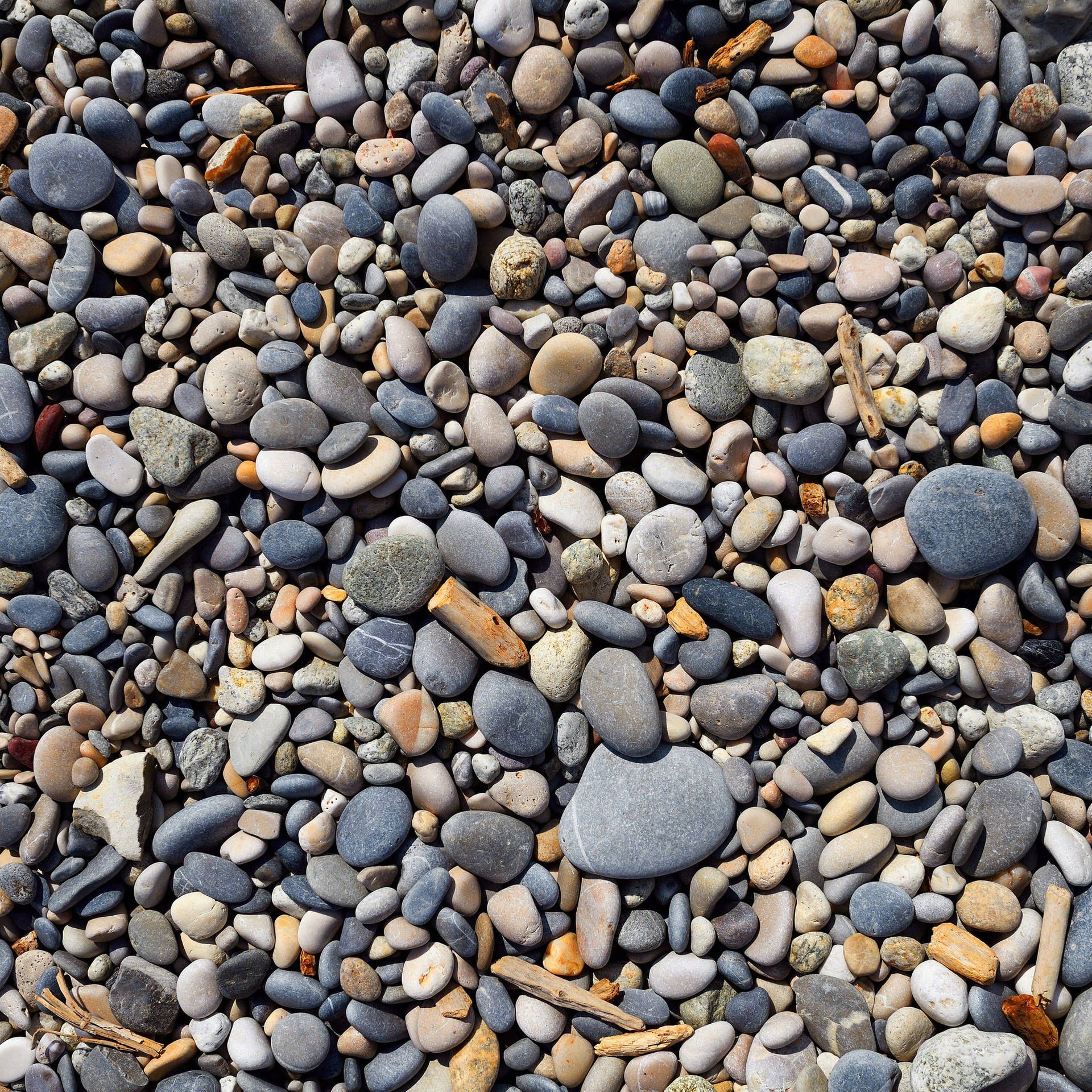 Warum findet man am Strand keine kugelrunden Steine bzw. Kiesel?